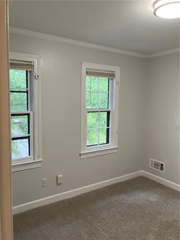 a view of front door with yard