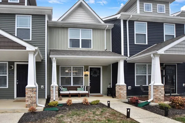 a front view of a house with a patio