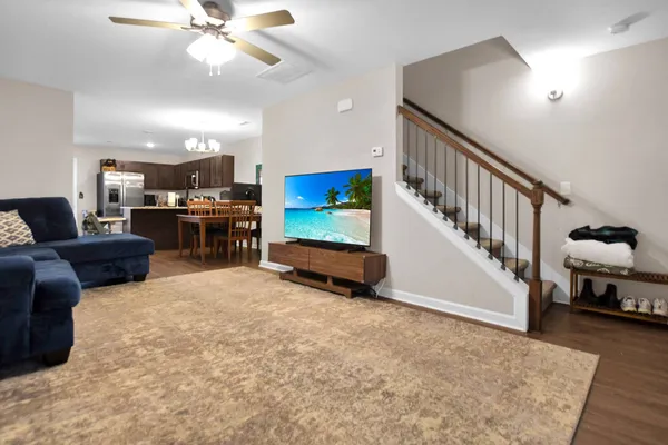 a living room with furniture and a flat screen tv