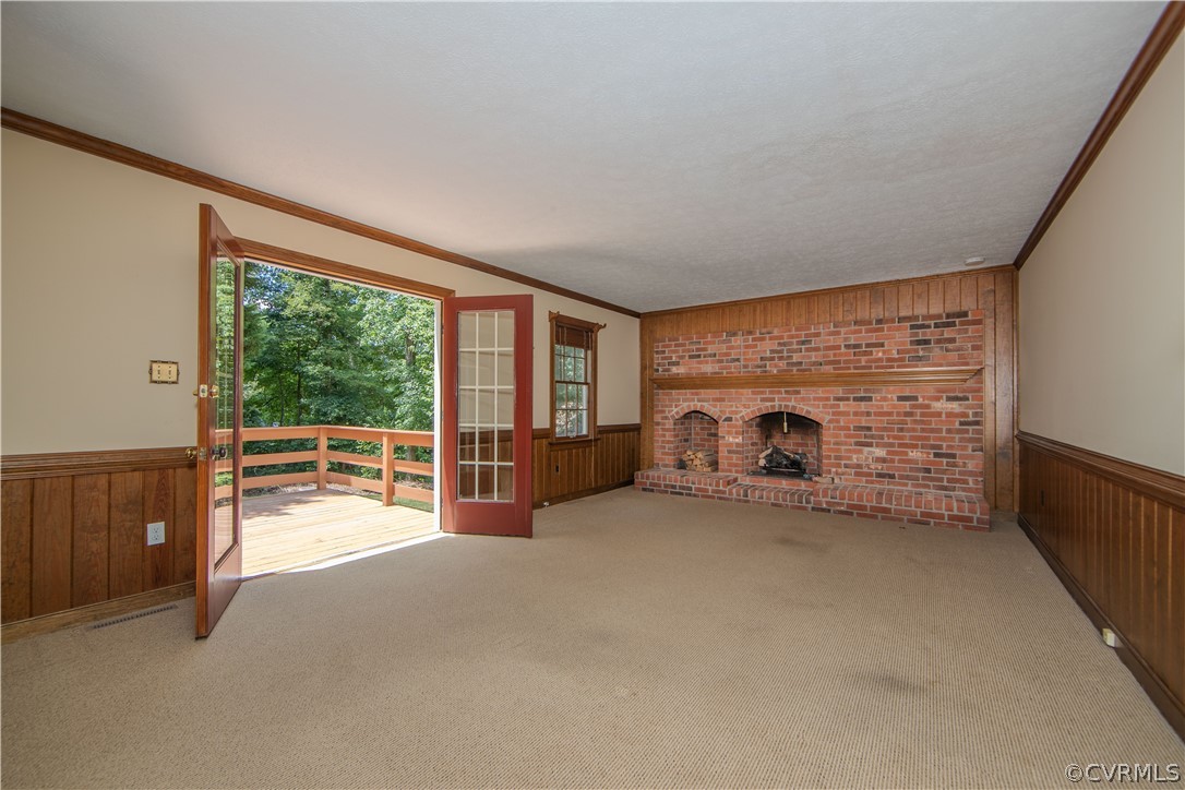 13319 Lady Ashley Road Midlothian, VA 23114 - Photo 11 of 41 an empty room with furniture and a fireplace