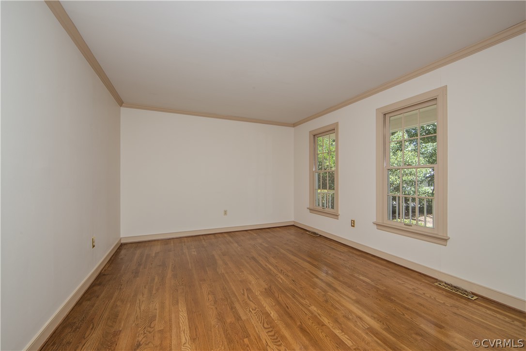 13319 Lady Ashley Road Midlothian, VA 23114 - Photo 10 of 41 an empty room with wooden floor and windows