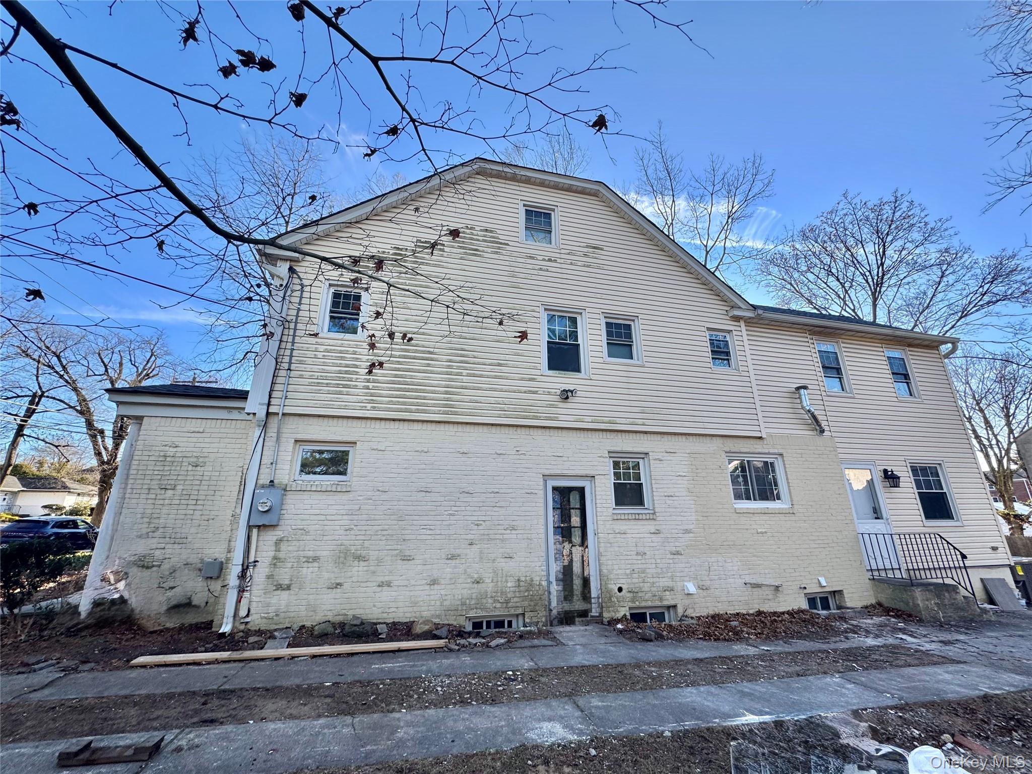 32 A Berkshire Road Great Neck, NY 11023 - Photo 13 of 38 Side of property with brick siding