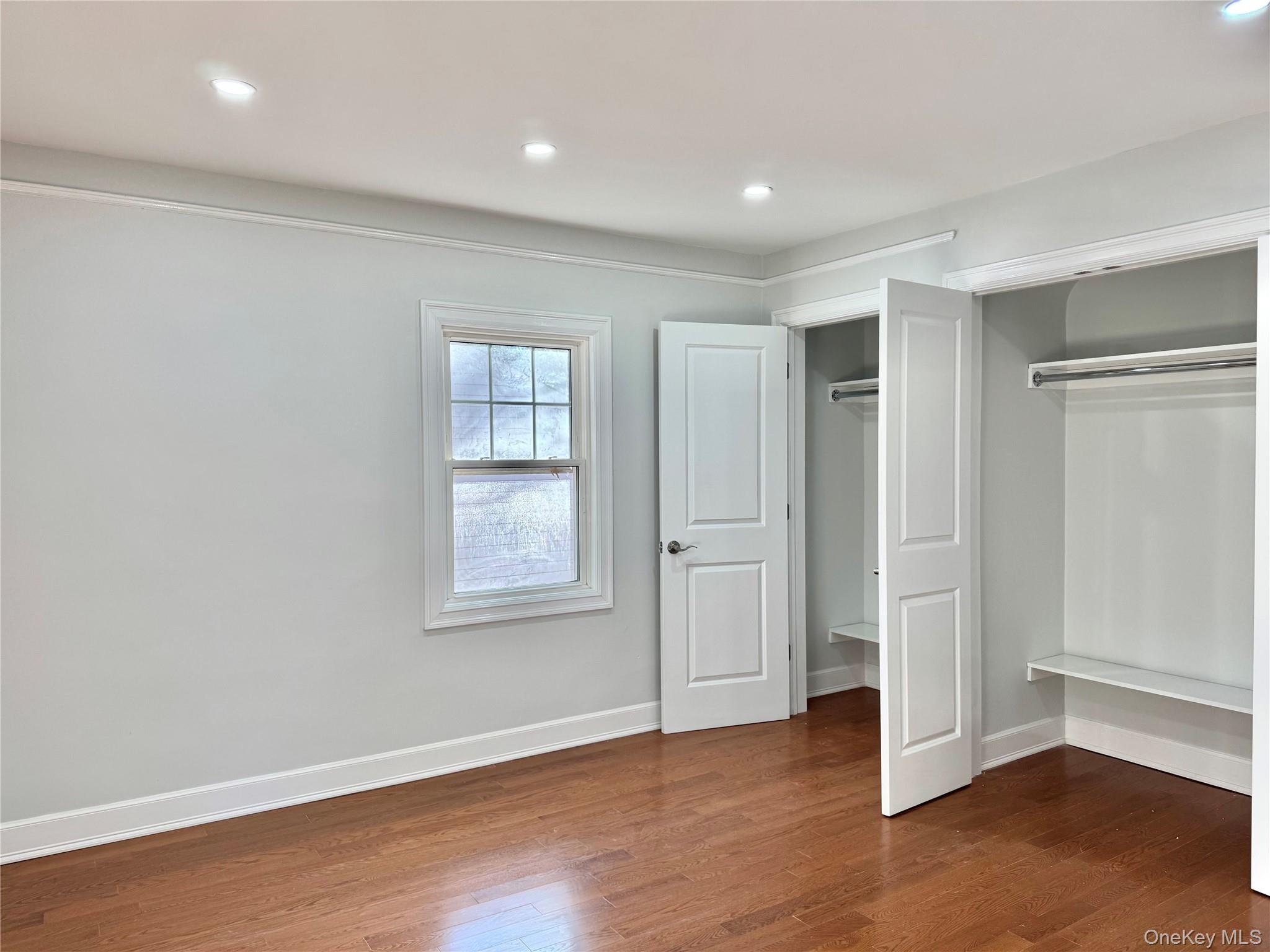 32 A Berkshire Road Great Neck, NY 11023 - Photo 19 of 38 Second Bedroom featuring dark wood-type flooring, a closet, and recessed lighting
