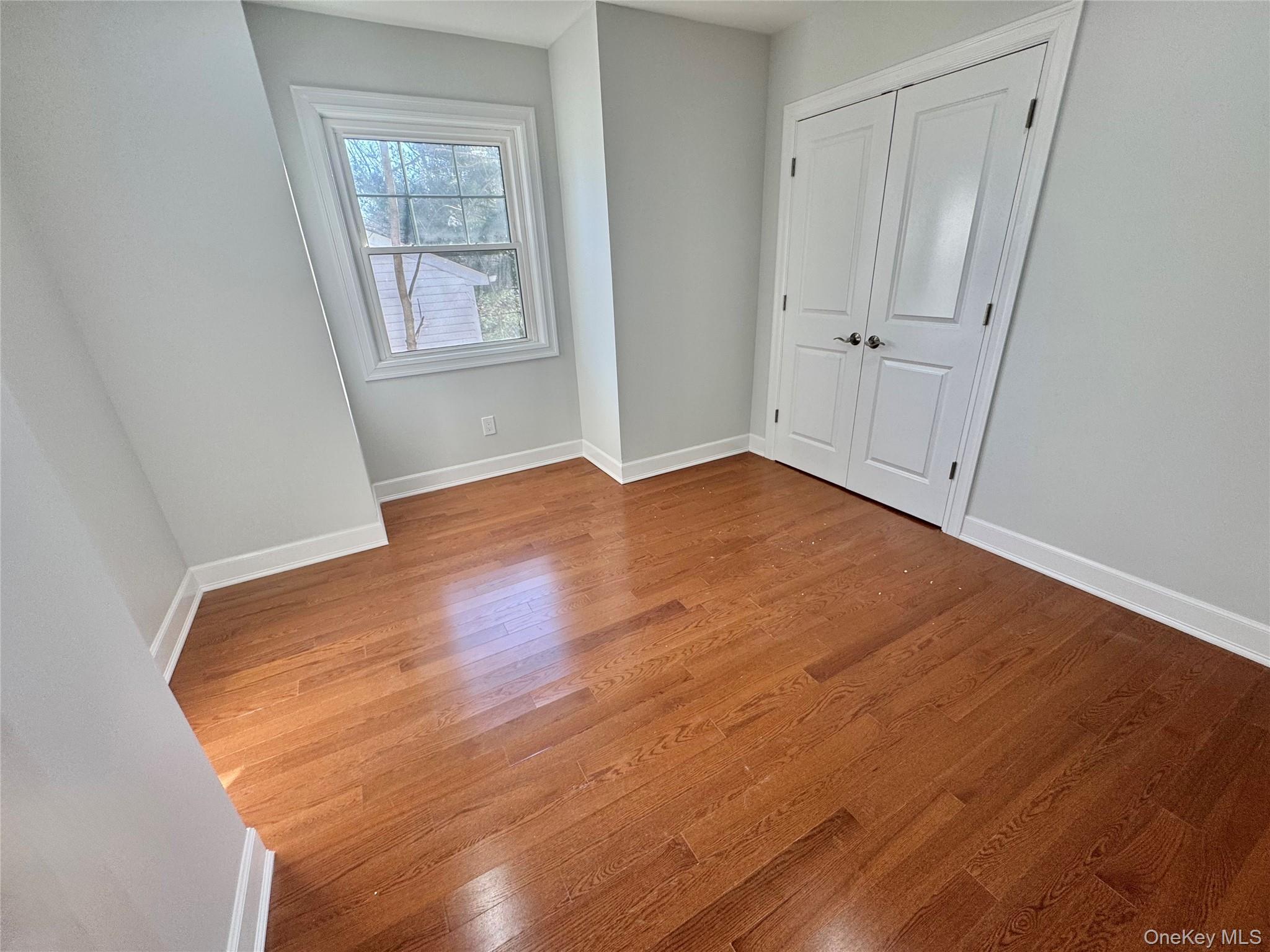32 A Berkshire Road Great Neck, NY 11023 - Photo 20 of 38 3rd Bedroom with light wood finished floors and a closet