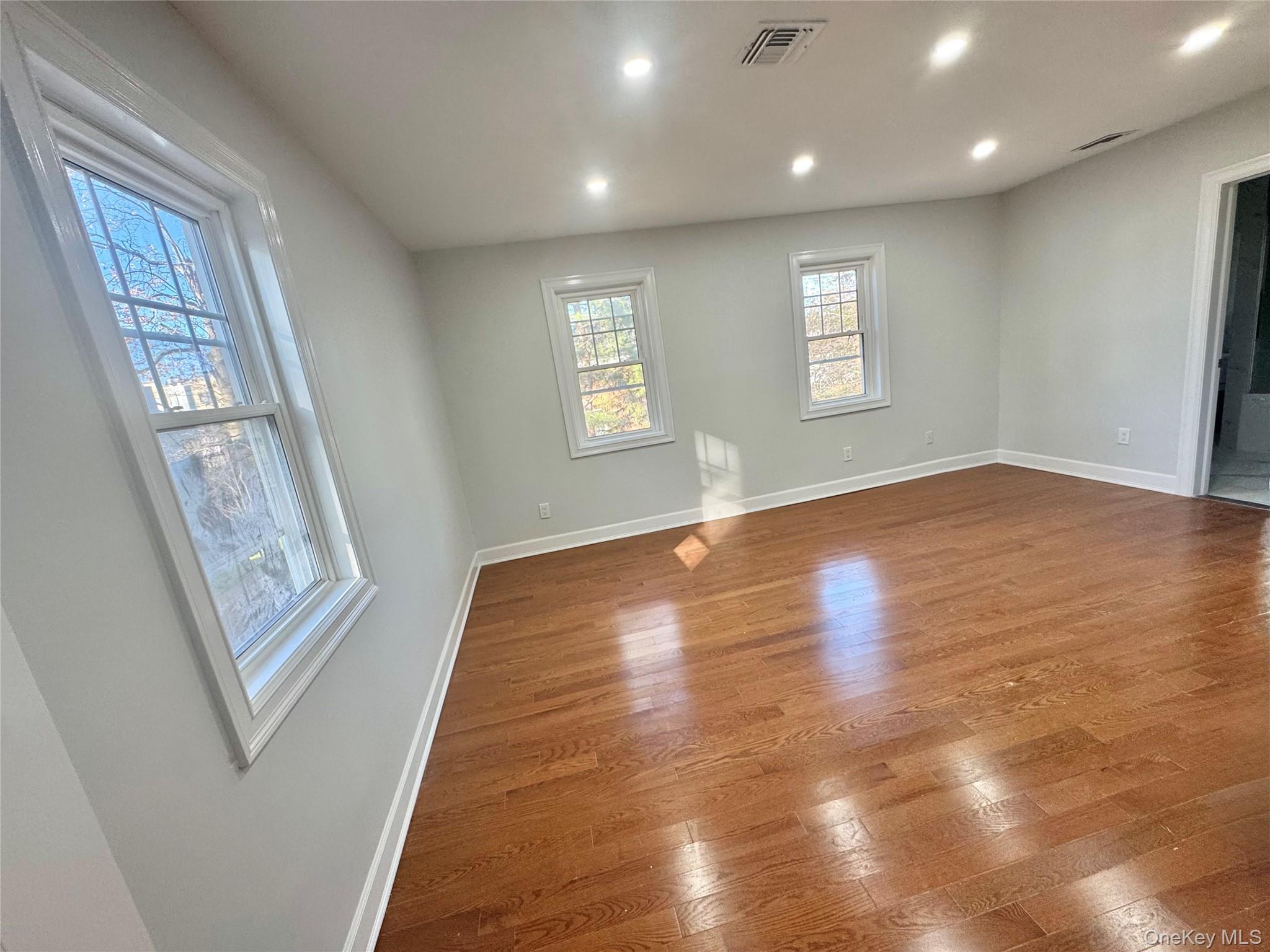 32 A Berkshire Road Great Neck, NY 11023 - Photo 23 of 38 Fourth Bedroom with wood finished floors and recessed lighting