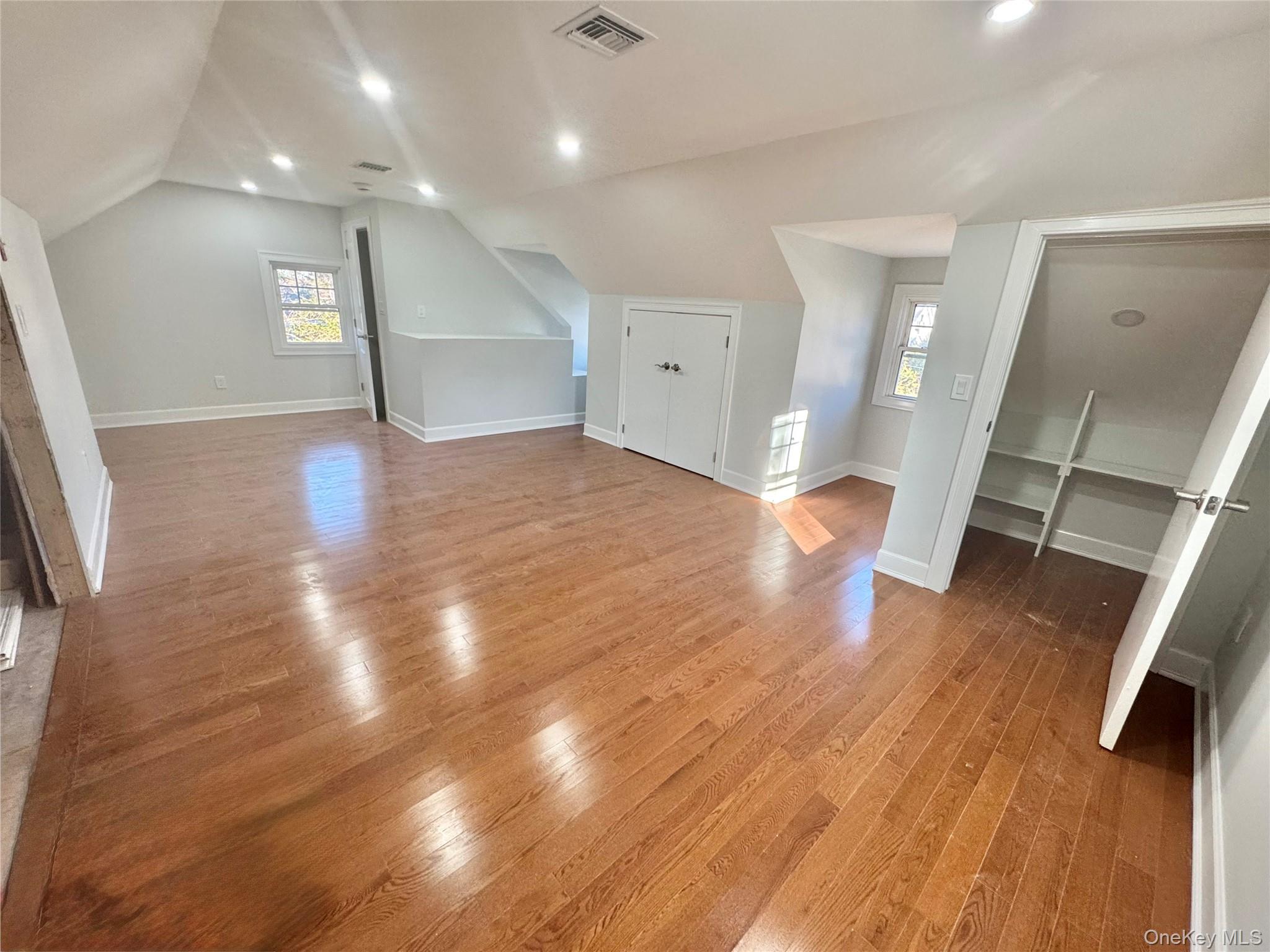 32 A Berkshire Road Great Neck, NY 11023 - Photo 24 of 38 Additional living space featuring light wood-style floors, lofted ceiling, and recessed lighting in 3rd floor