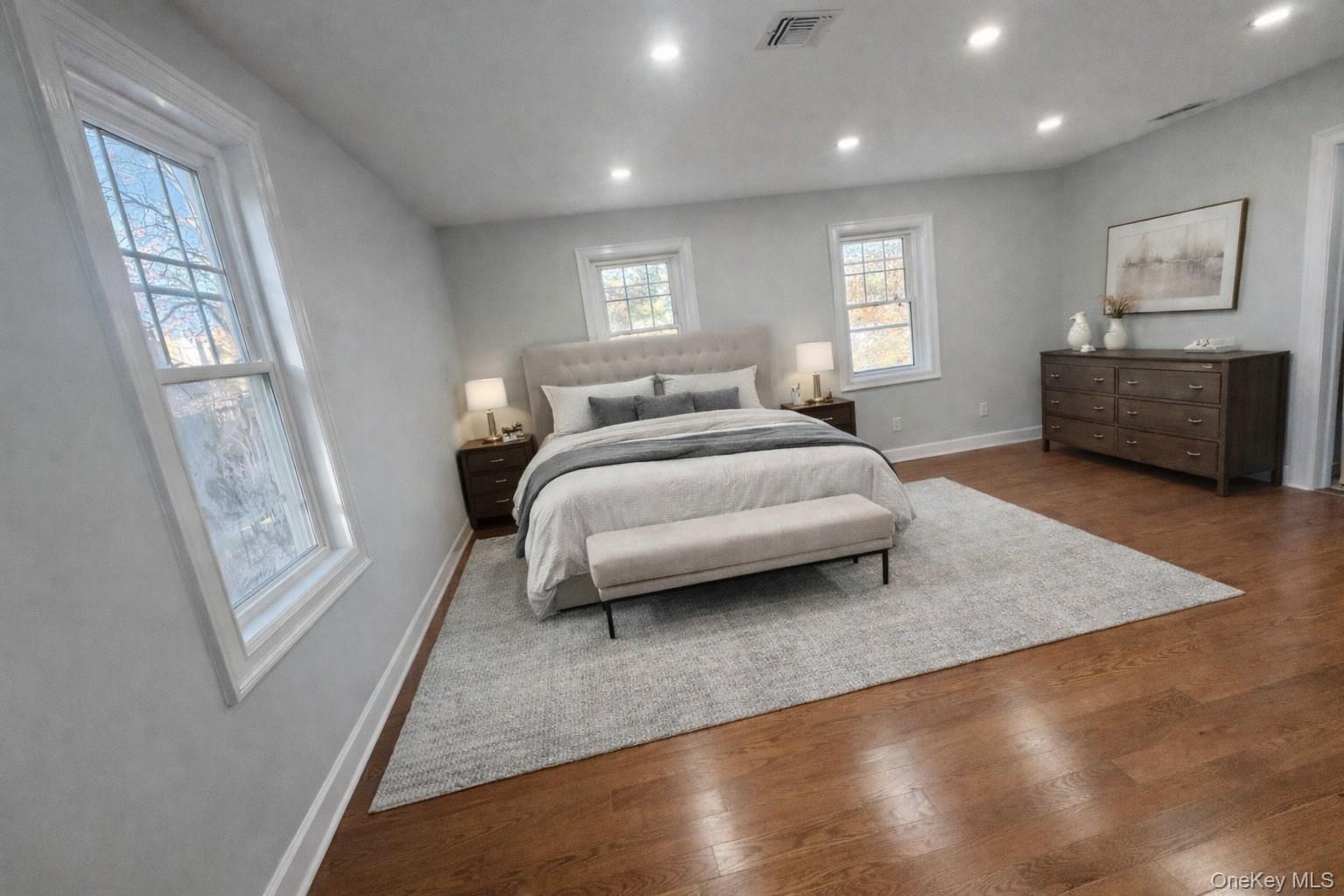 32 A Berkshire Road Great Neck, NY 11023 - Photo 8 of 38 Staged Bedroom with wood finished floors and recessed lighting