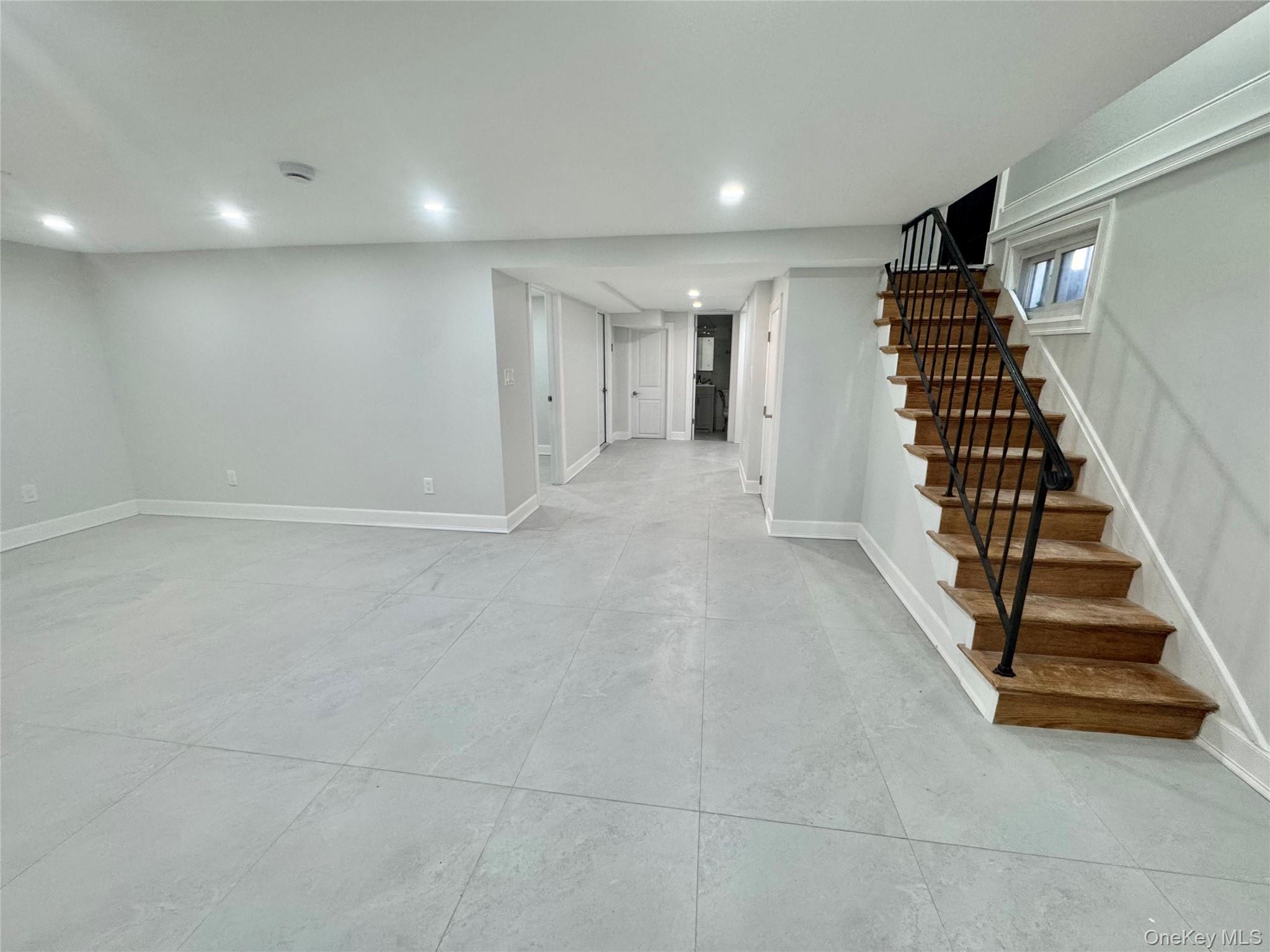 32 A Berkshire Road Great Neck, NY 11023 - Photo 10 of 38 Finished below grade area featuring recessed lighting and stairway