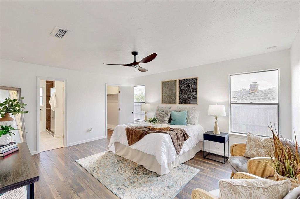 3965 Singleleaf Lane Fort Worth, TX 76133 - Photo 15 of 39 Bedroom featuring wood-finish flooring, white walls, and a contemporary ceiling fan
