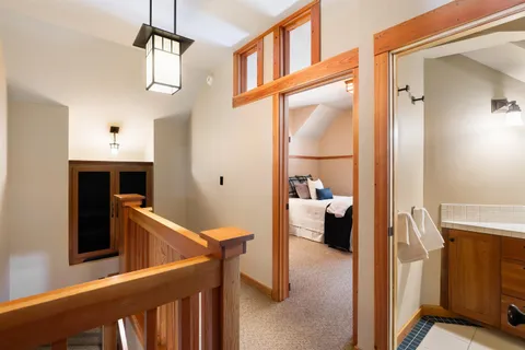 a bedroom with two beds and a large window