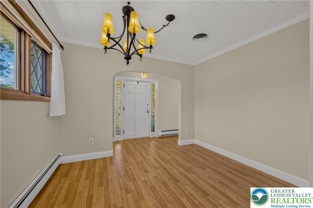 1814 Ruth Street Allentown, PA 18104 - Photo 8 of 54 Gleaming hardwood floors and a classic arched transition define this inviting entryway space.