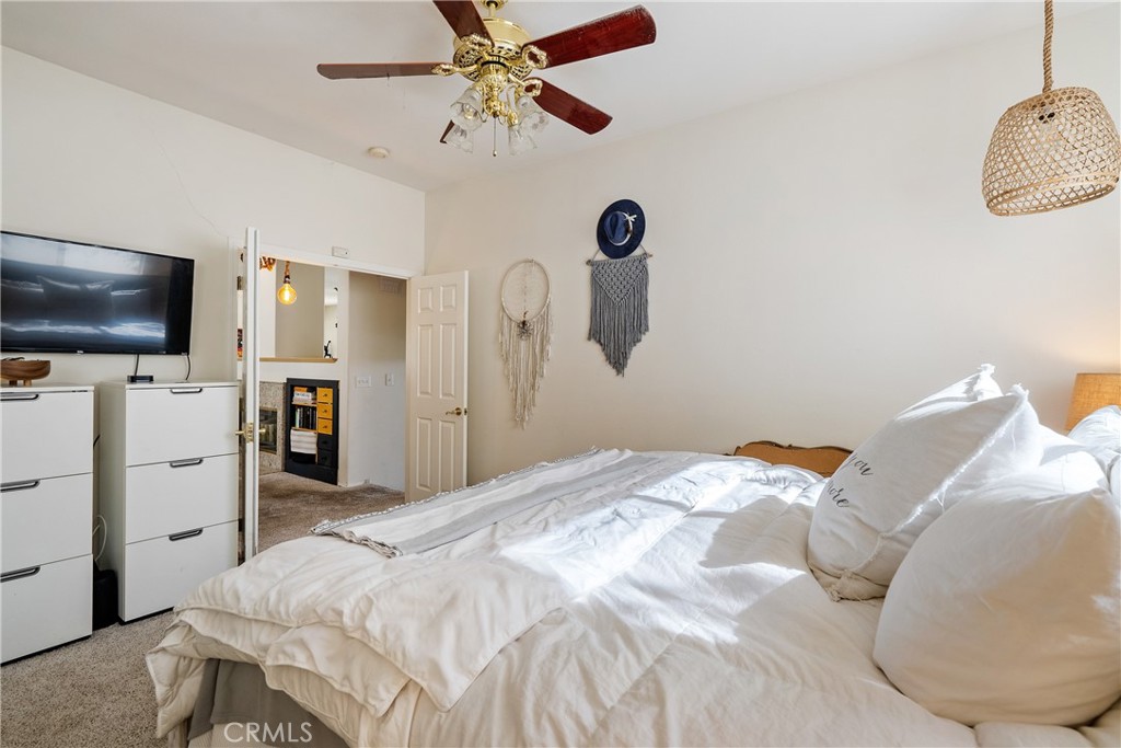 1329 Crown Way Paso Robles, CA 93446 - Photo 24 of 57 a bedroom with a bed and a flat screen tv