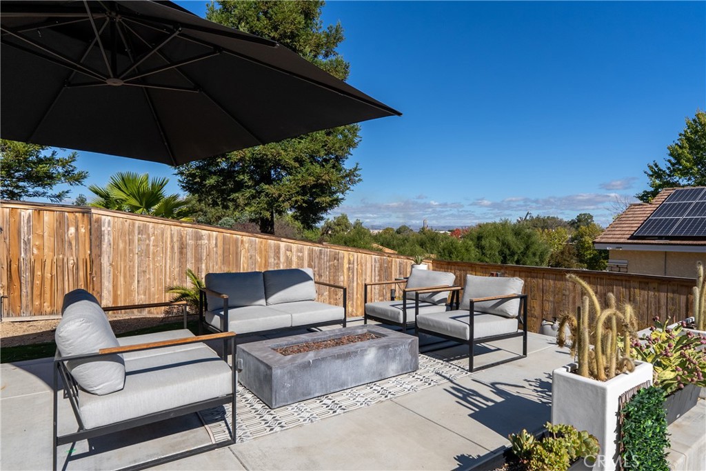1329 Crown Way Paso Robles, CA 93446 - Photo 45 of 57 an outdoor sitting area with furniture and umbrella