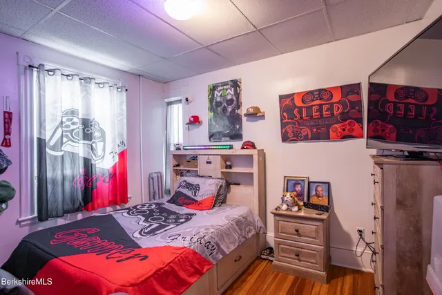 a bedroom with a bed and a closet