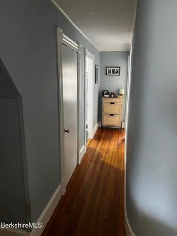 a bedroom with a bed and a tv