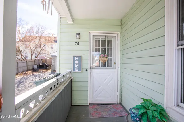 a view of kitchen with stainless steel appliances granite countertop cabinets and outdoor view