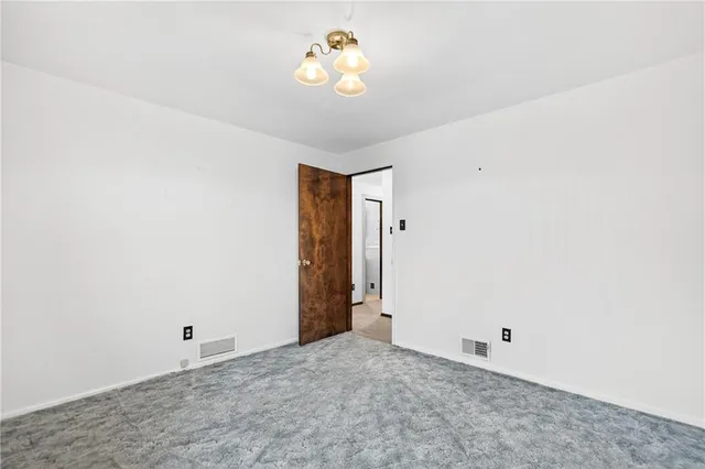 a view of a bathroom from a hallway