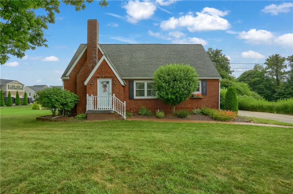 104 Hepler Road Sarver, PA 16055 - Photo 1 of 30 a front view of a house with garden