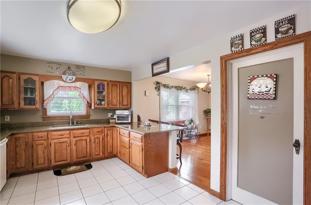 104 Hepler Road Sarver, PA 16055 - Photo 12 of 30 a view of a kitchen with a sink and cabinets