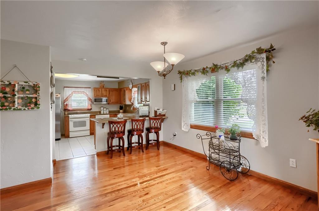 104 Hepler Road Sarver, PA 16055 - Photo 16 of 30 a view of a a dining room with furniture window and wooden floor