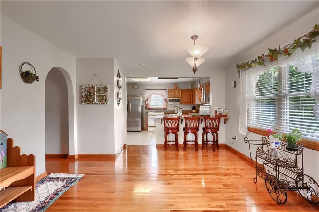 104 Hepler Road Sarver, PA 16055 - Photo 17 of 30 a dining room with furniture a chandelier and wooden floor
