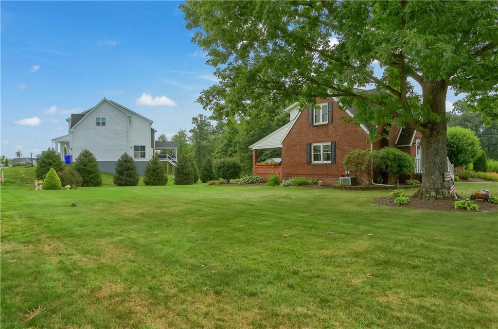 104 Hepler Road Sarver, PA 16055 - Photo 3 of 30 a front view of house with garden