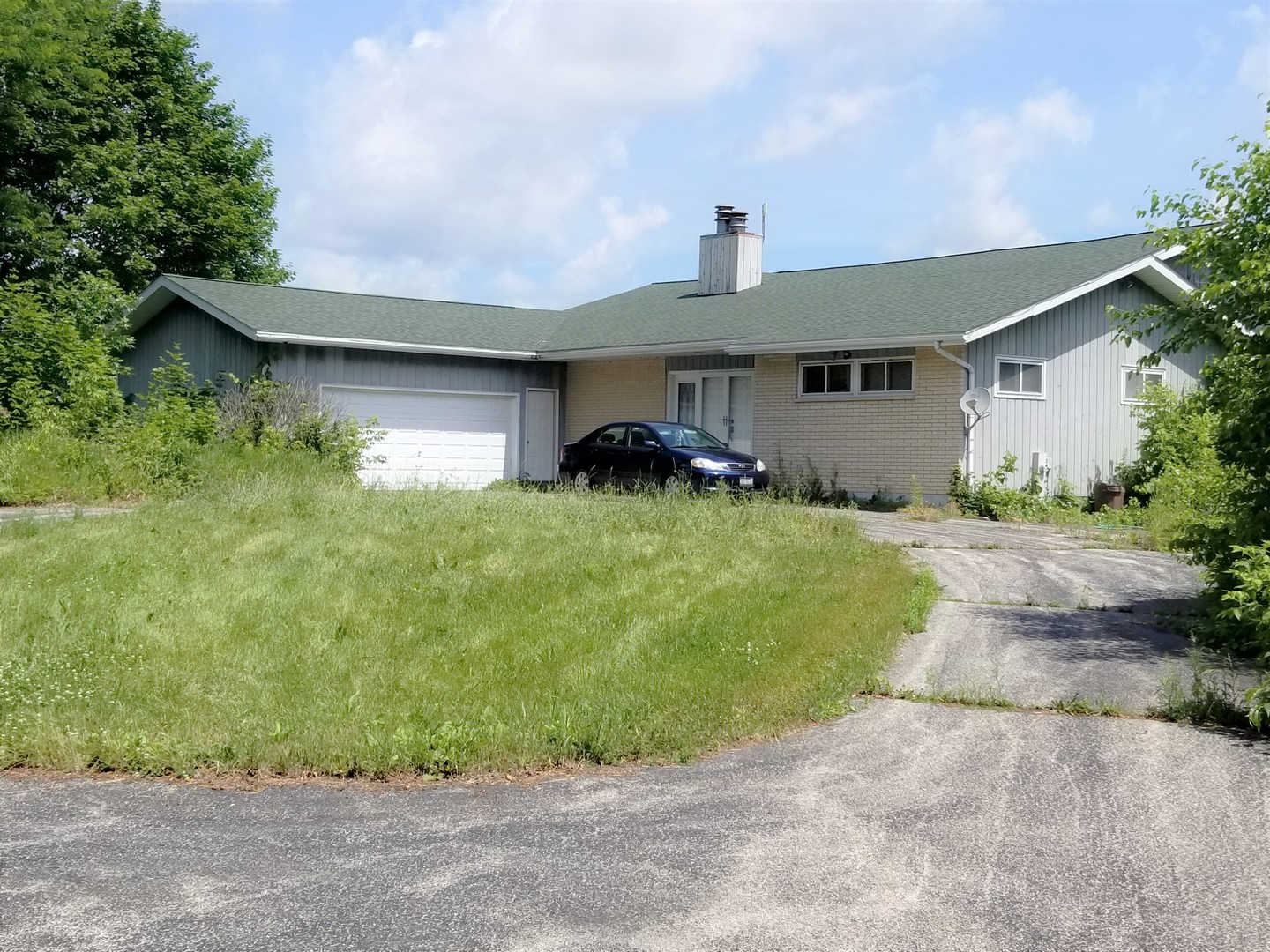 a front view of a house with yard