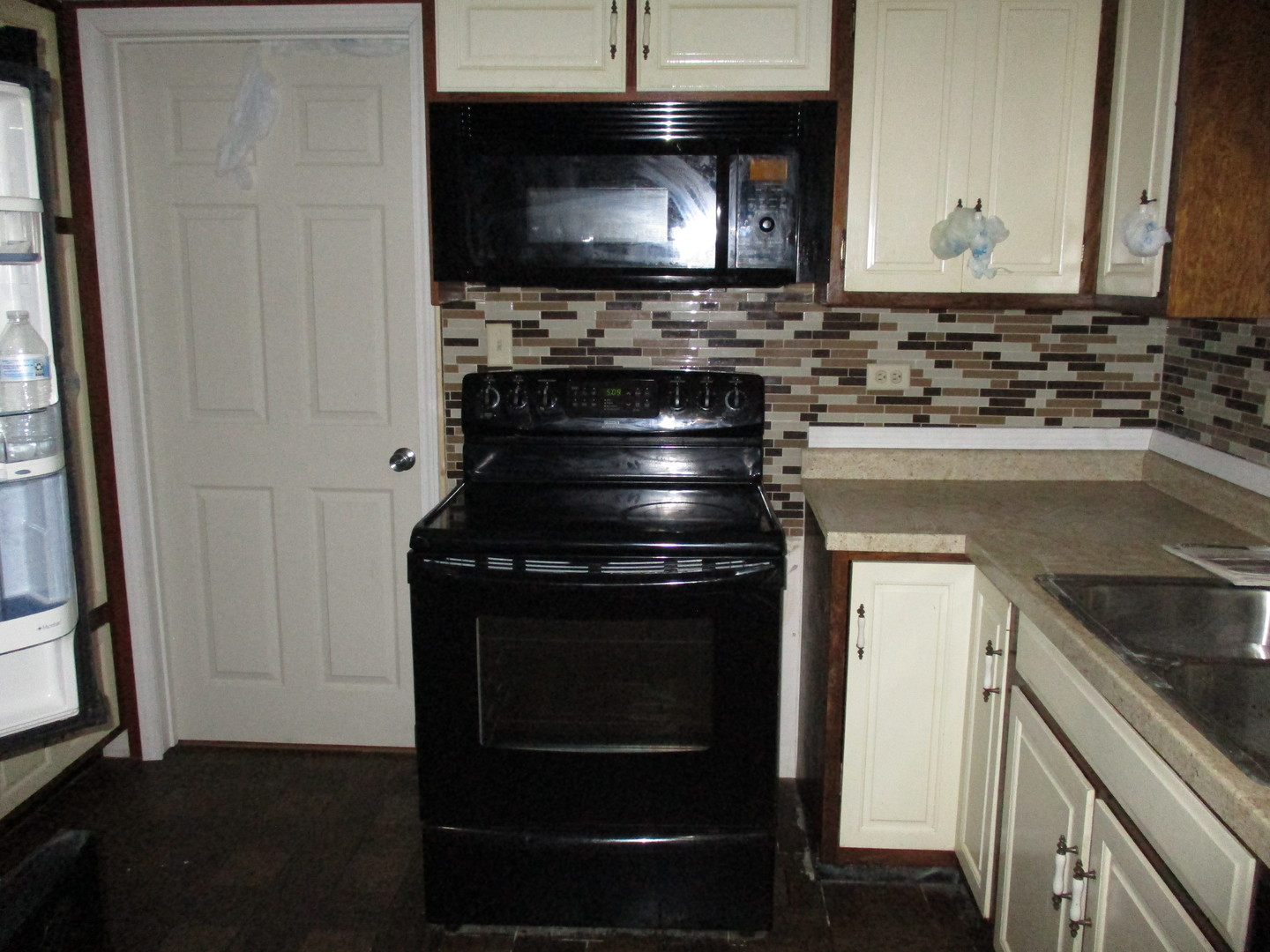 16814 Green Road Harvard, IL 60033 - Photo 6 of 18 a kitchen with a stove and a microwave