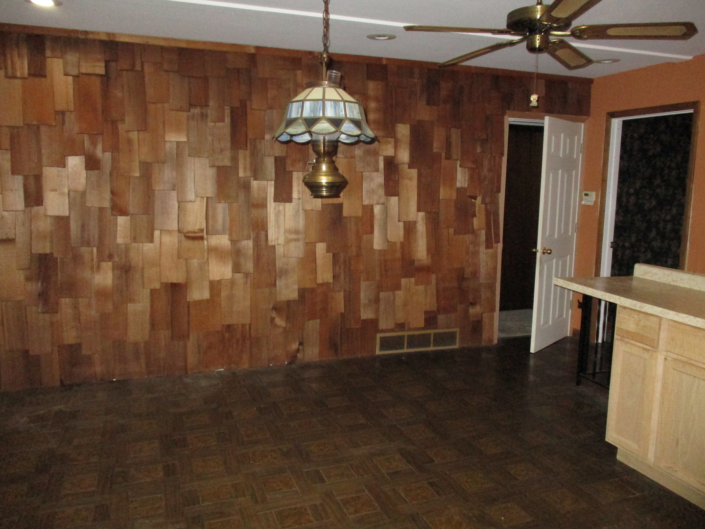 16814 Green Road Harvard, IL 60033 - Photo 9 of 18 a view of a hallway with wooden floor and chandelier