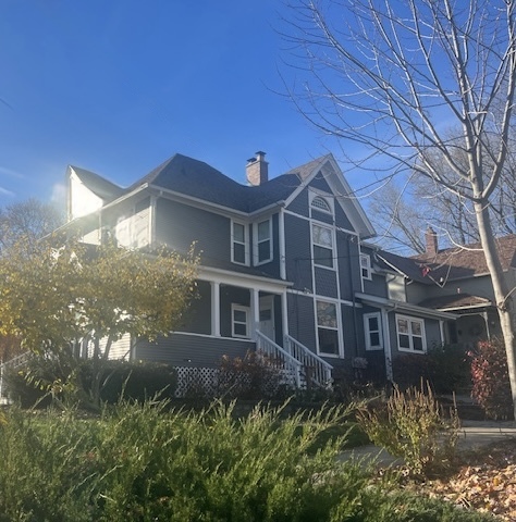 103 South 4th Street, Unit 1 St. Charles, IL 60174 - Photo 1 of 22 a front view of a house with a garden