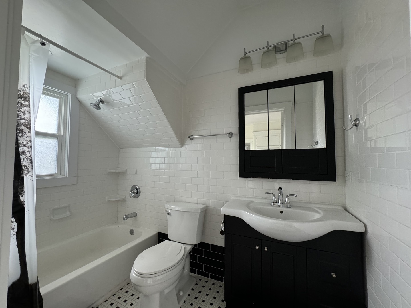 103 South 4th Street, Unit 1 St. Charles, IL 60174 - Photo 18 of 22 a bathroom with a toilet sink double vanity and mirror