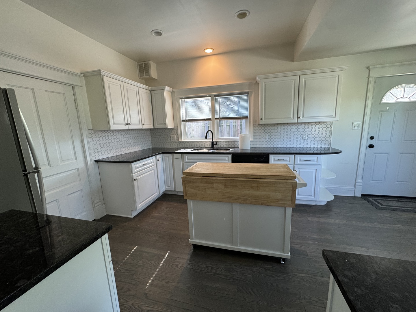 103 South 4th Street, Unit 1 St. Charles, IL 60174 - Photo 7 of 22 a kitchen with stainless steel appliances granite countertop a stove a sink and a refrigerator
