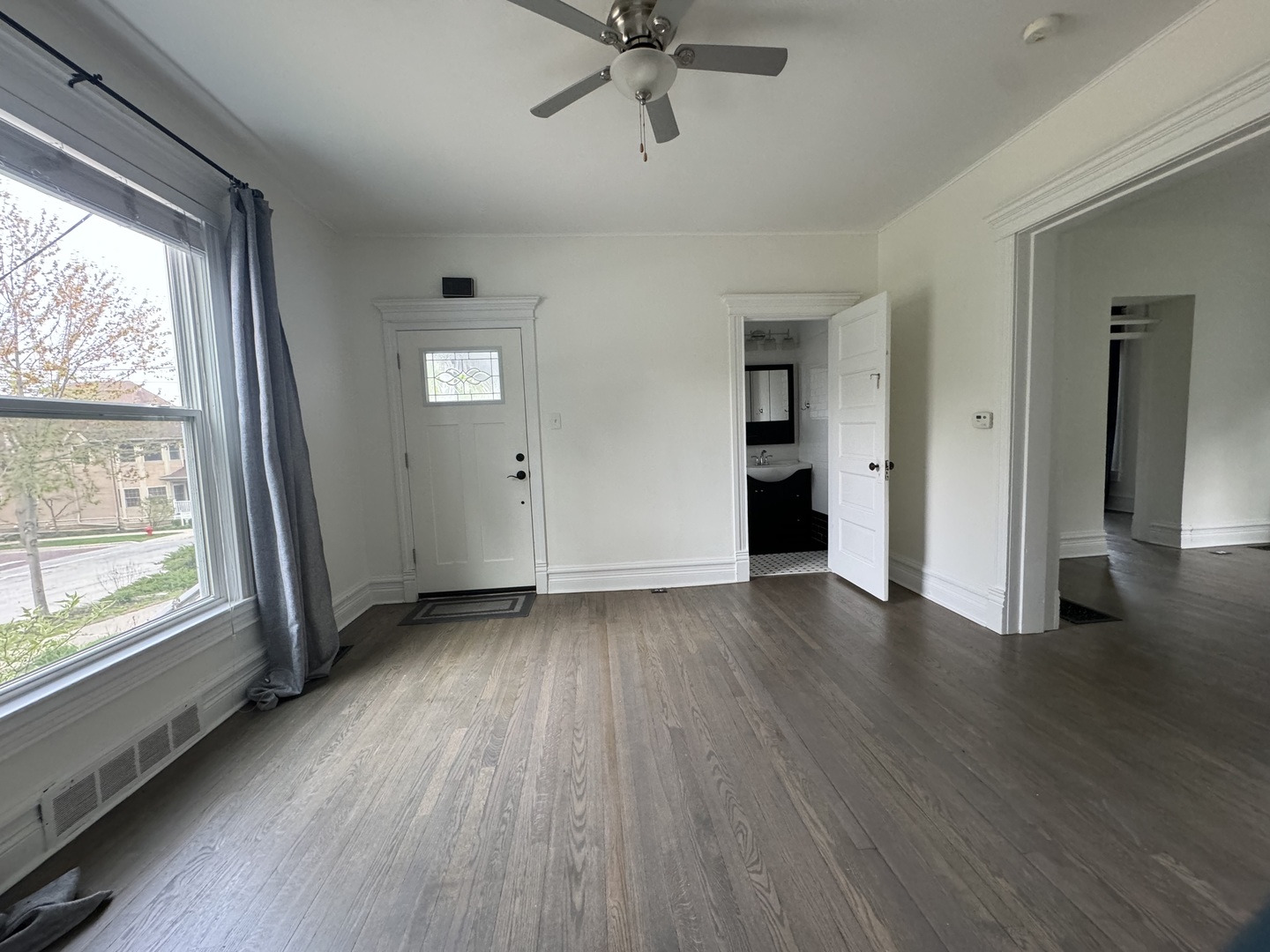 103 South 4th Street, Unit 1 St. Charles, IL 60174 - Photo 10 of 22 wooden floor in an empty room with a window
