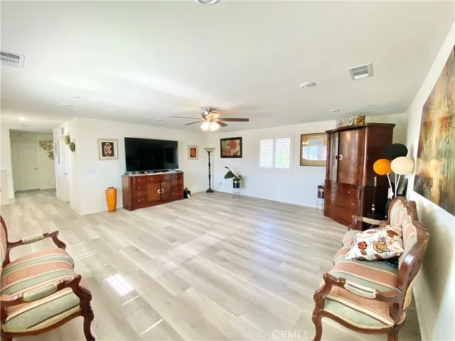 a room with furniture and flat screen tv