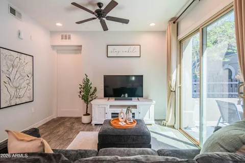 a living room with furniture and a large window