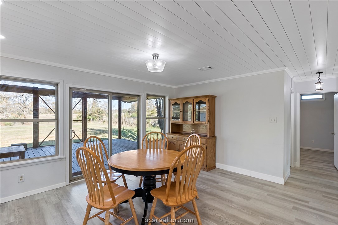 8801 Old Reliance Road Bryan, TX 77808 - Photo 7 of 24 Dining area surrounded by windows overlooking the backyard.