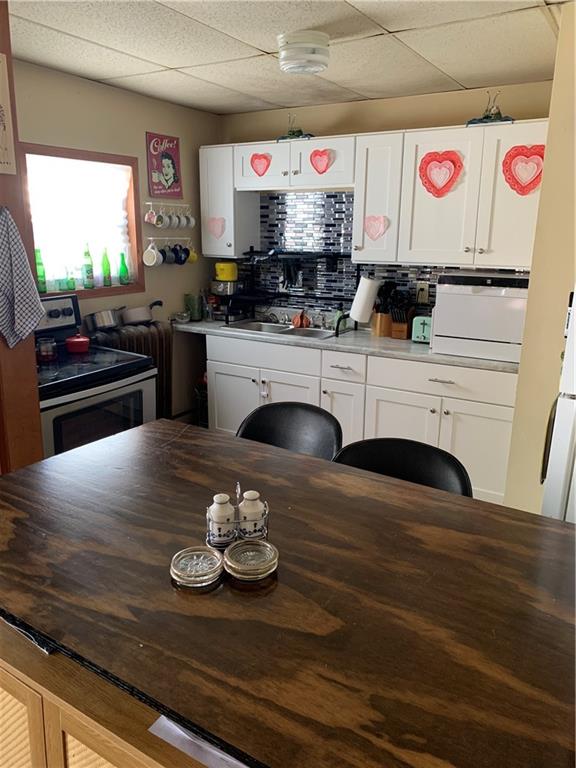 498 East High Street Kittanning, PA 16201 - Photo 3 of 6 a kitchen with a stove and cabinets