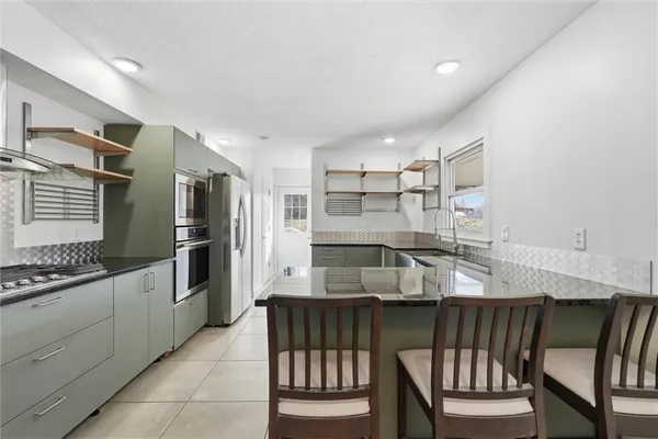 $539,900 | 1038 North Woodland Court, Oakwood, MO 64118