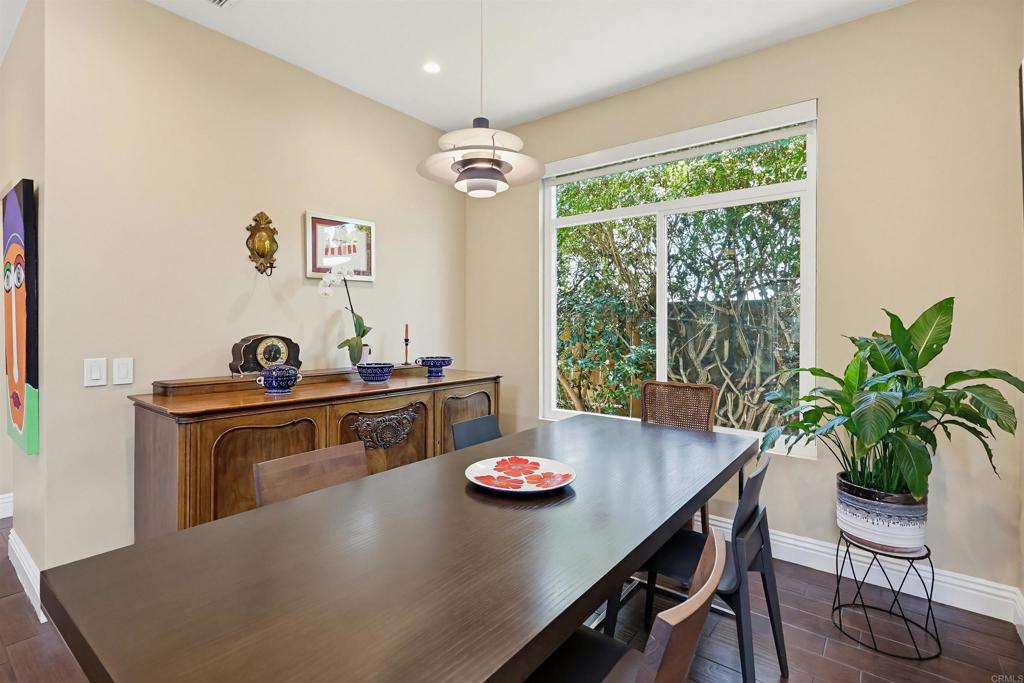 2756 Southampton Road Carlsbad, CA 92010 - Photo 29 of 40 a view of a workspace with a table and a potted plant