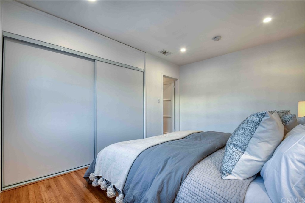 1041 Rose Avenue Pasadena, CA 91107 - Photo 20 of 33 a bedroom with a bed and a wooden floor