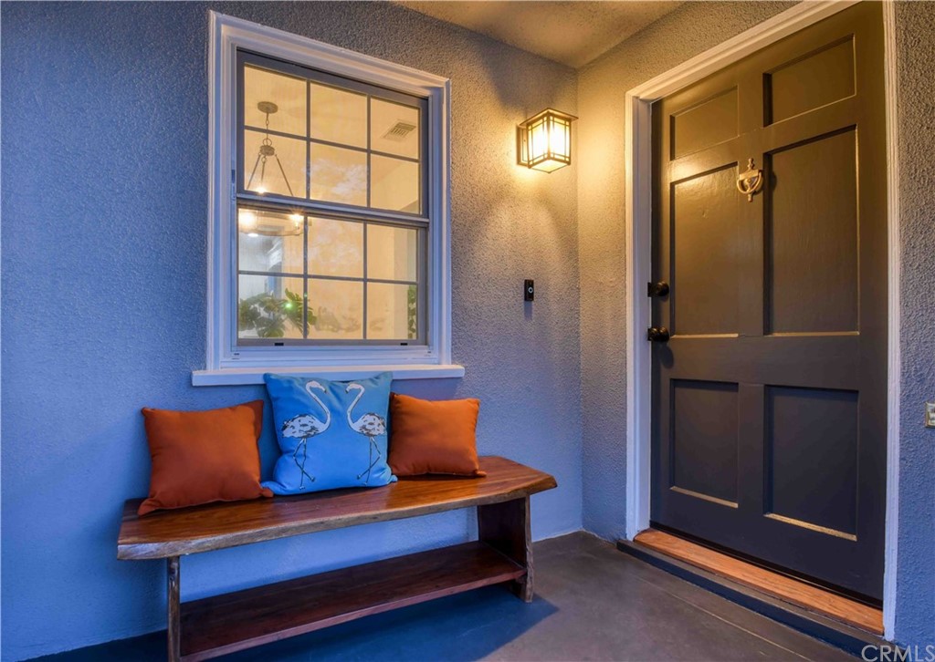 1041 Rose Avenue Pasadena, CA 91107 - Photo 4 of 33 a blue bench sitting in front of a door