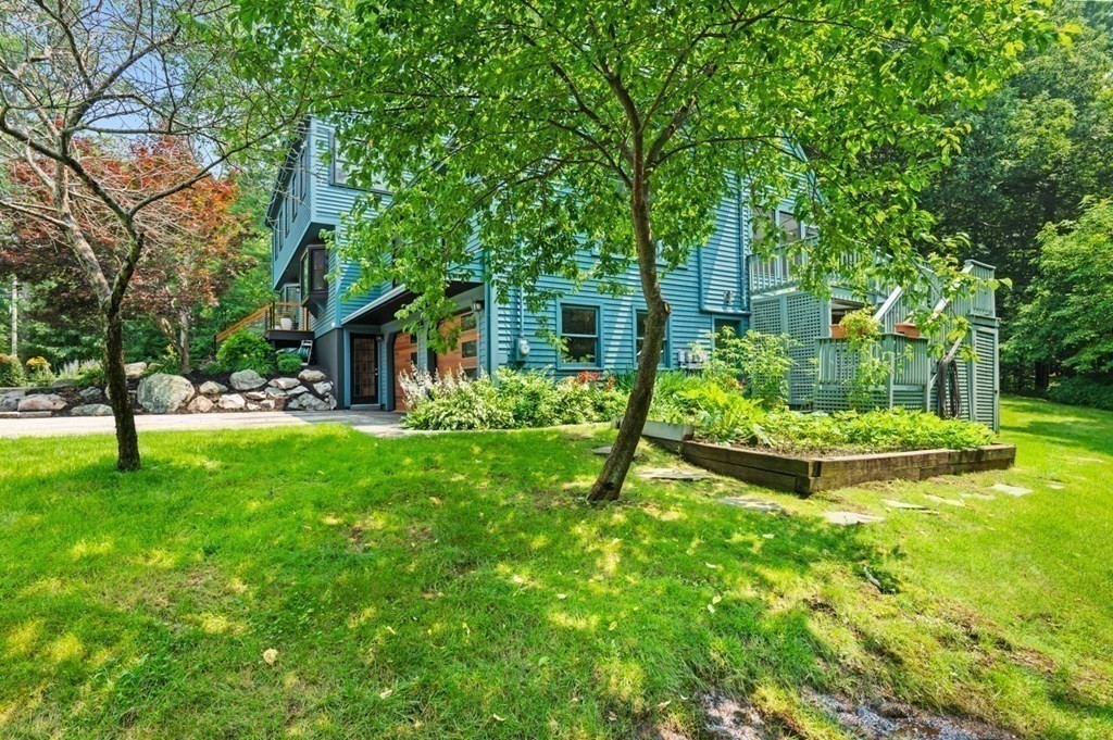 17 Woodman Road Amesbury, MA 01913 - Photo 30 of 38 a view of a house with backyard and sitting area