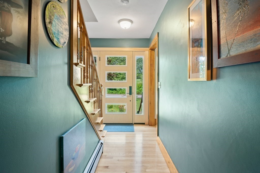 17 Woodman Road Amesbury, MA 01913 - Photo 3 of 38 a view of an entryway with a mirror