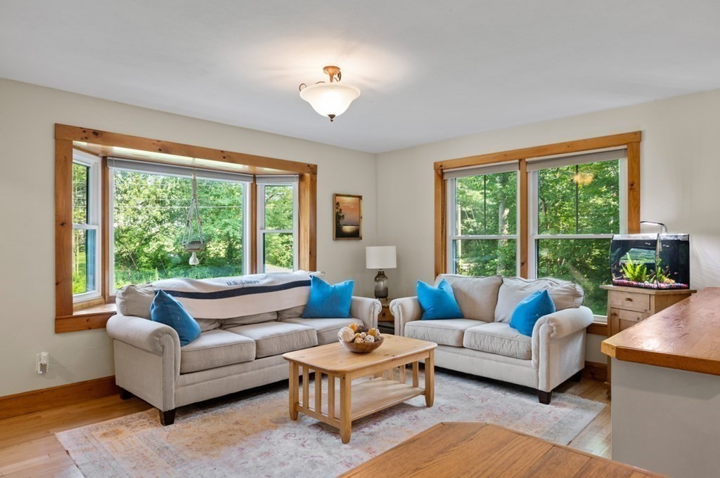 17 Woodman Road Amesbury, MA 01913 - Photo 4 of 38 a living room with furniture and a large window