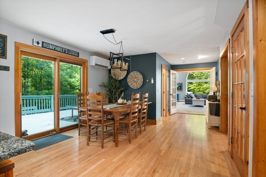 17 Woodman Road Amesbury, MA 01913 - Photo 8 of 38 a view of a dining room with furniture window and wooden floor
