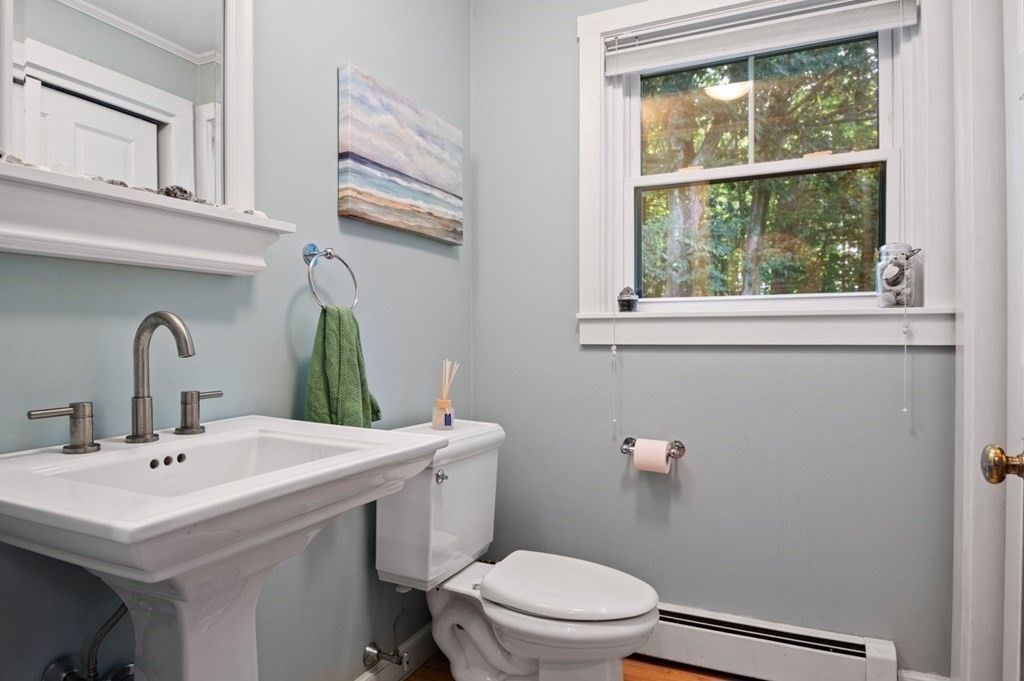 17 Woodman Road Amesbury, MA 01913 - Photo 9 of 38 a bathroom with a sink a toilet and a mirror
