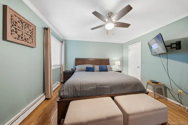 a bedroom with a large bed and a window