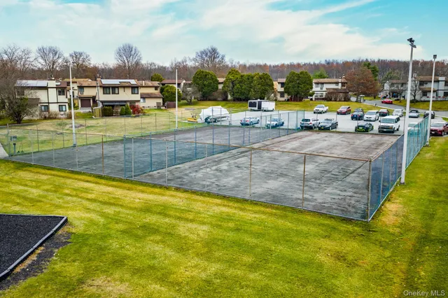 a view of a swimming pool with a lounge chair