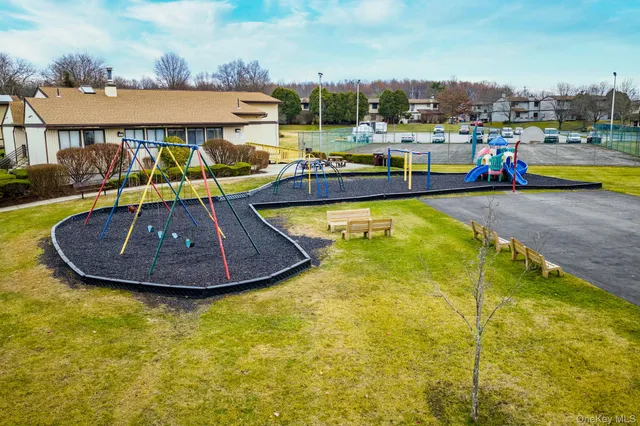 a view of a swimming pool with a yard