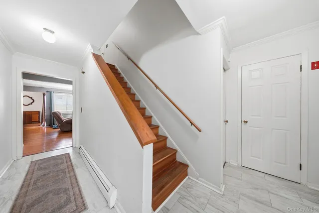 a view of a hallway view with staircase